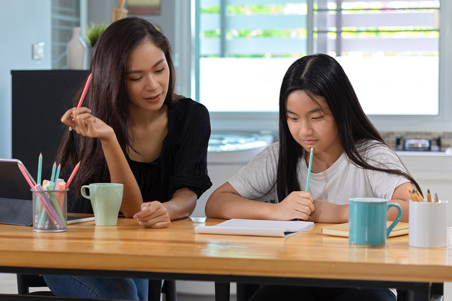 student and tutor together at a desk in Long Beach